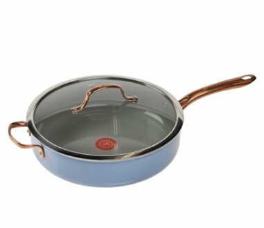 Blue nonstick pan with glass lid and copper handle