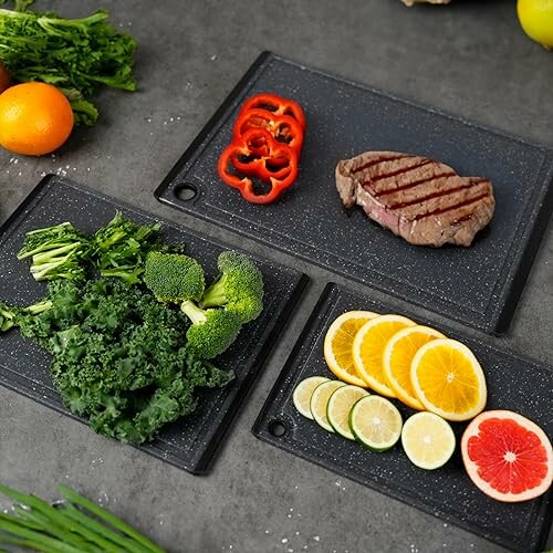 Assorted vegetables, fruits, and grilled steak on cutting boards.