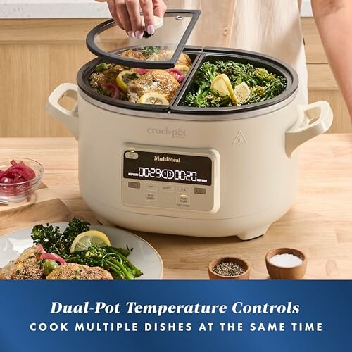 Dual-pot crock pot with separate dishes cooking.