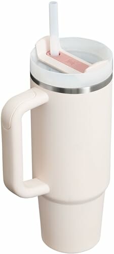 Insulated travel mug with handle and straw lid.