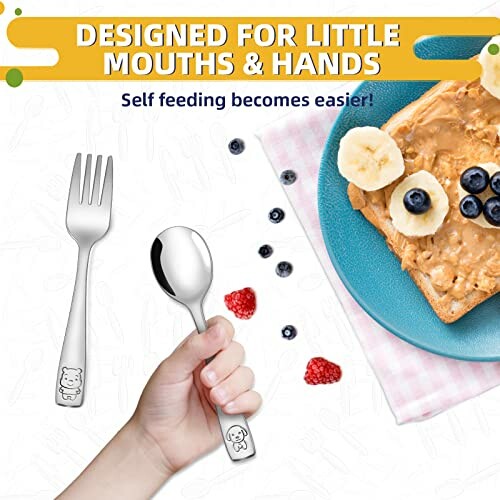 Child holding spoon and fork near toast with peanut butter and fruit