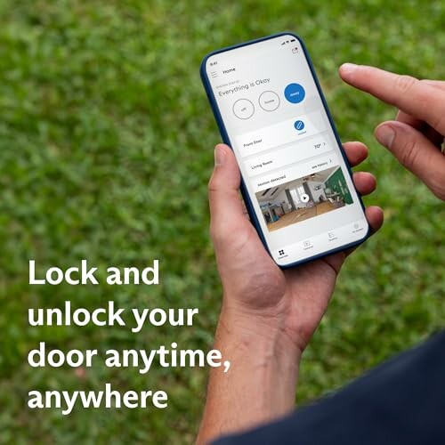 Person using smartphone app to control door lock